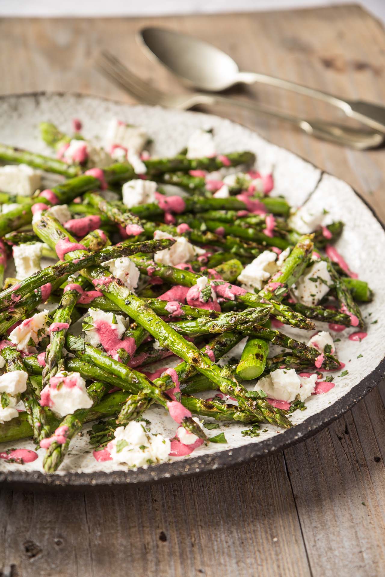Griddled British asparagus with feta and beetroot dressing British